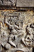 Prambanan - Dance sculptures. Female dancer with sword and shield at Bharata's coronation, Shiva Temple.  